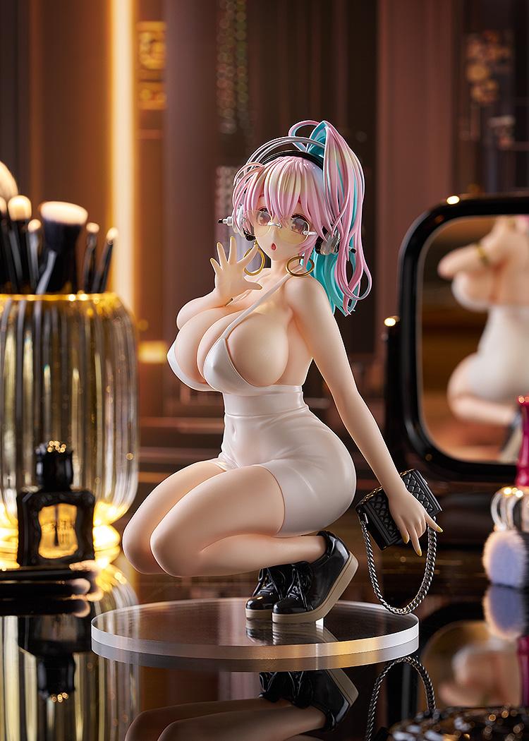 The Super Sonico figure displayed in a studio setting with a vanity mirror and makeup accessories.