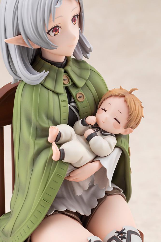 Angled upper-body close-up of Sylphiette Greyrat's green buttoned cape and baby Lucie Greyrat.