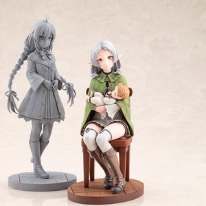 Fully painted Sylphiette and Lucie Greyrat figure displayed beside an unpainted gray prototype companion figure.