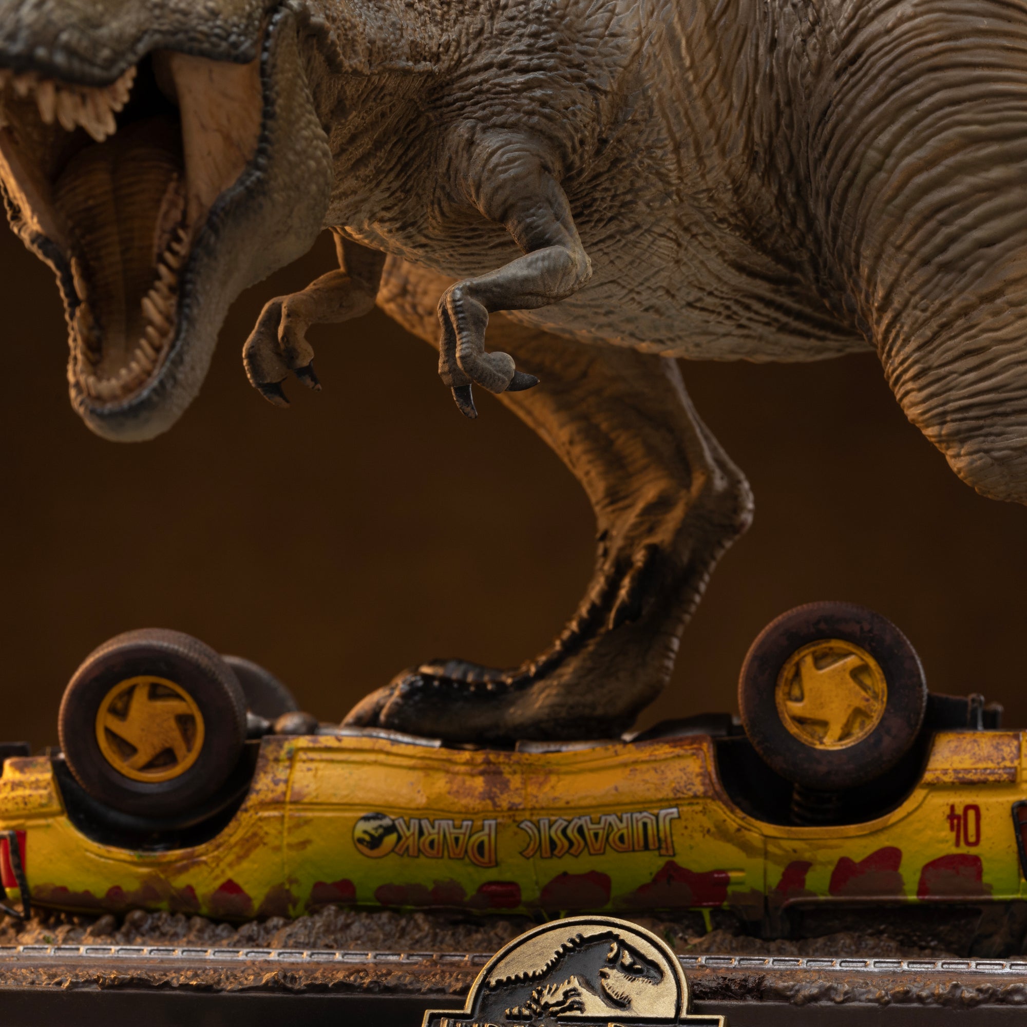 Detailed macro shot highlighting the small front arms, ribcage texture, and scaled skin on the torso of the Iron Studios Jurassic Park Icons T-Rex figure.