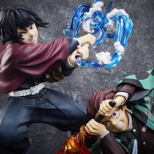 Focus on Giyu Tomioka and Tanjiro Kamado fighting side by side with water and fire effects in the Aniplex battle figure