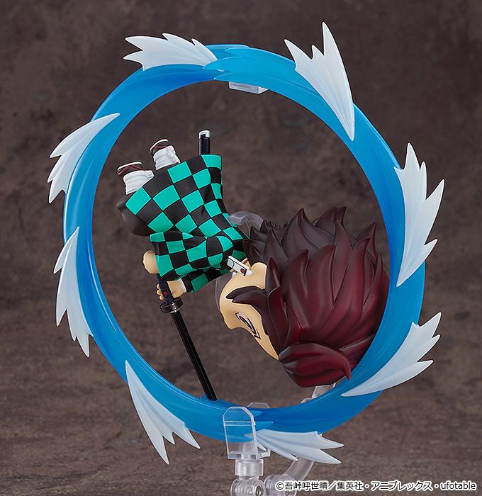 Side view of the Tanjiro Nendoroid executing a Water Breathing technique, showing the circular effect detail.