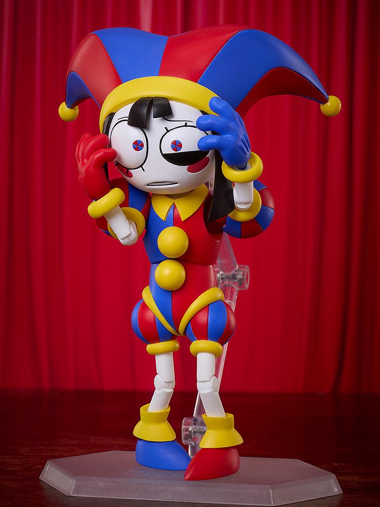 Pomni figma action figure holding her hands to the sides of her head in a state of panic and distress, displayed on a clear articulated stand with a dark red background.