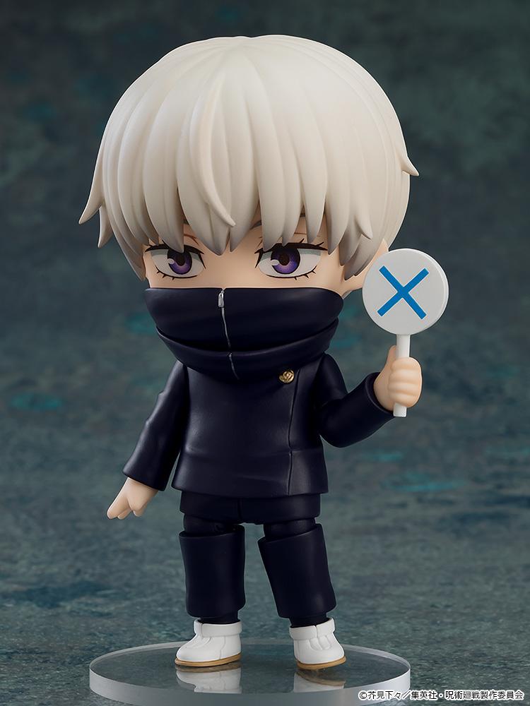 Toge Inumaki Nendoroid with closed neck warmer holding the blue X sign accessory.