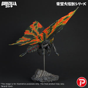 Three-quarter right profile of the Battra Imago kaiju figure poised in mid-flight above the ruined building display stand.
