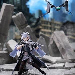 Tactical crouching action pose of the Tololo figma figure aiming her Planeta rifle on a ruined concrete battlefield diorama with her floating drone nearby.