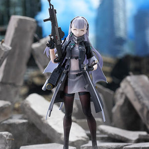 Tololo figma figure standing amidst ruined concrete city rubble, featuring a smiling expression while holding her Planeta assault rifle upright.