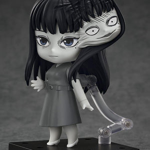 Side view of Tomie Nendoroid with laughing face plate and the secondary head growing from her hair.
