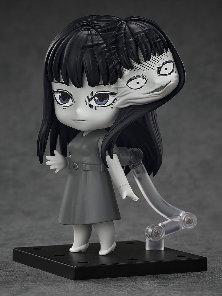 Side view of Tomie Nendoroid with laughing face plate and the secondary head growing from her hair.