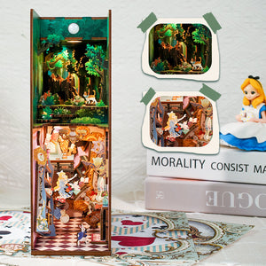 Frontal view of the assembled book nook interior, showing Alice falling, the Mad Hatter's tea party, and the forest above.