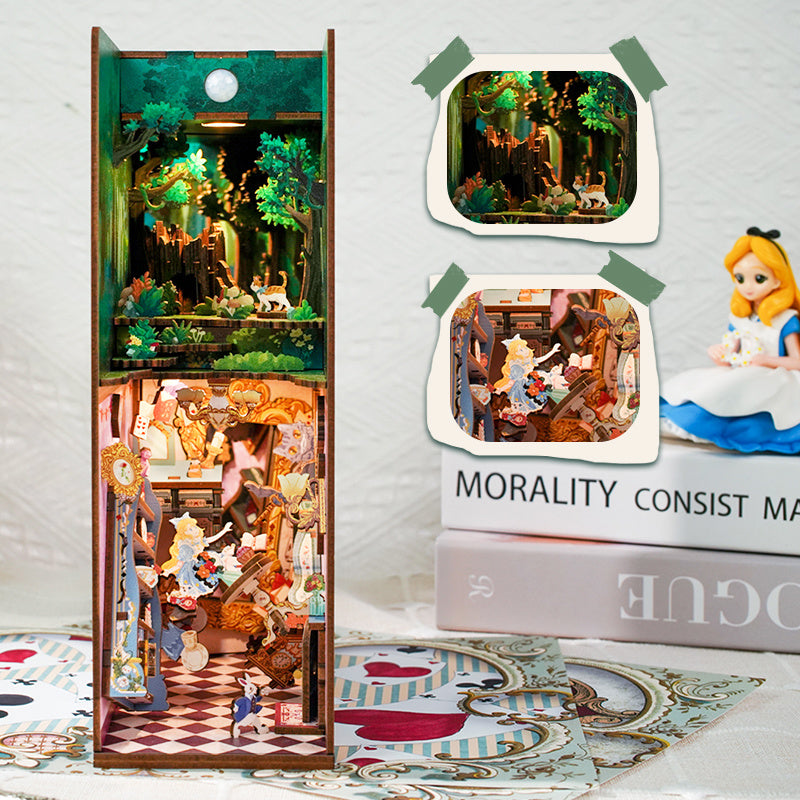 Frontal view of the assembled book nook interior, showing Alice falling, the Mad Hatter's tea party, and the forest above.