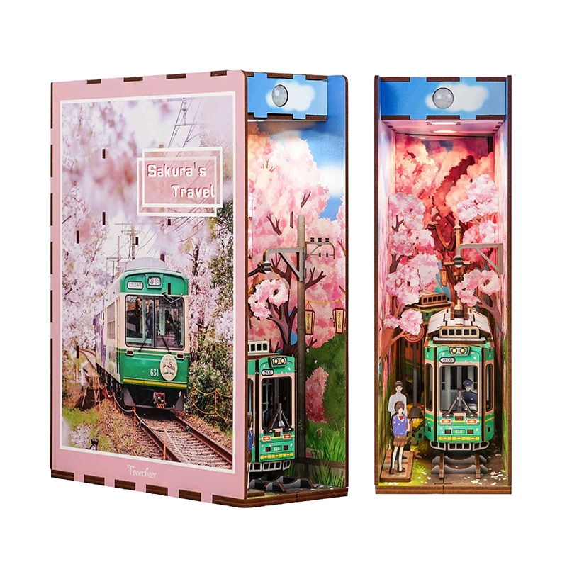 Product shot of the assembled Tonecheer DIY book end, showcasing the illuminated green tram and pink sakura trees in a Japanese setting.
