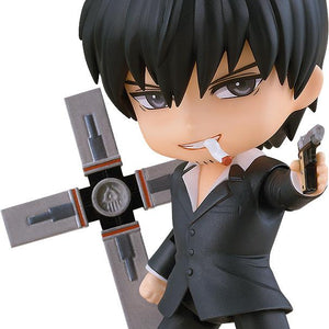 Isolated studio shot of the Trigun Maximum Nicholas D. Wolfwood Nendoroid figure holding the Punisher cross and aiming a pistol with a cigarette in his mouth on a white background.