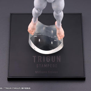 Close-up of the black display base printed with Trigun Stampede Millions Knives logo and clear magnetic foot stand