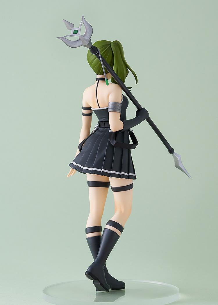 Rear view of the Ubel collectible figure, highlighting the intricate design of her staff-like weapon and the back of her black pleated dress.