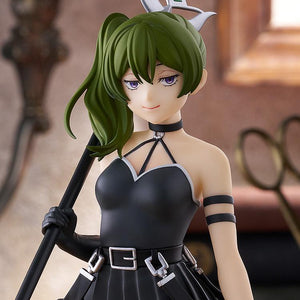 A medium shot of the Ubel figure in a lifestyle display, focusing on the character's signature pose and the detailed sculpt of her dress and weapon.