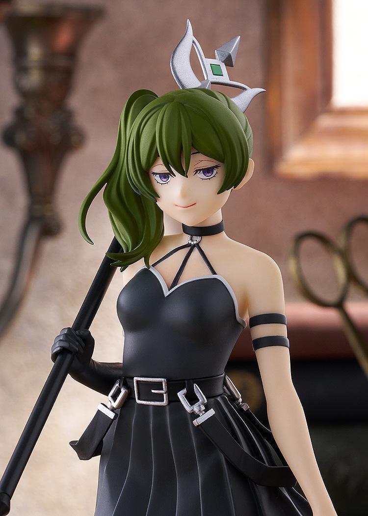 A medium shot of the Ubel figure in a lifestyle display, focusing on the character's signature pose and the detailed sculpt of her dress and weapon.