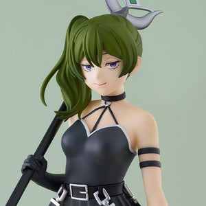 A close-up headshot of the Ubel anime figure, showcasing her smug expression, green side-ponytail, and black choker.