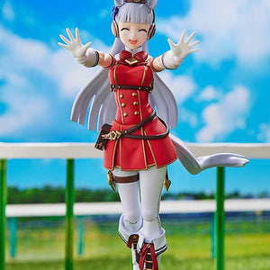 Playful victory pose of Gold Ship figma at the race track with arms outstretched and a joyful smile.
