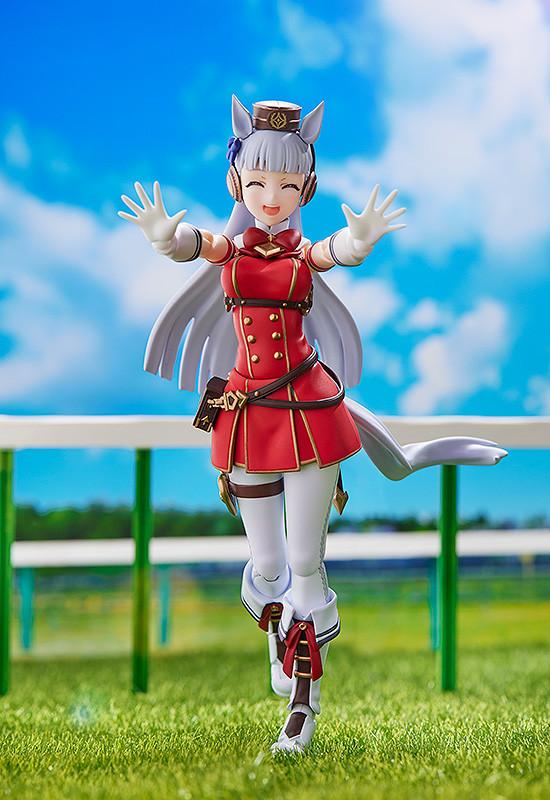 Playful victory pose of Gold Ship figma at the race track with arms outstretched and a joyful smile.