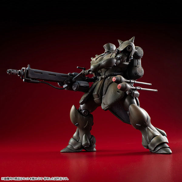Dynamic side firing pose of the painted MegaHouse VAKIT Geara Doga Commander Type model kit, displaying its articulation and weathered green finish.