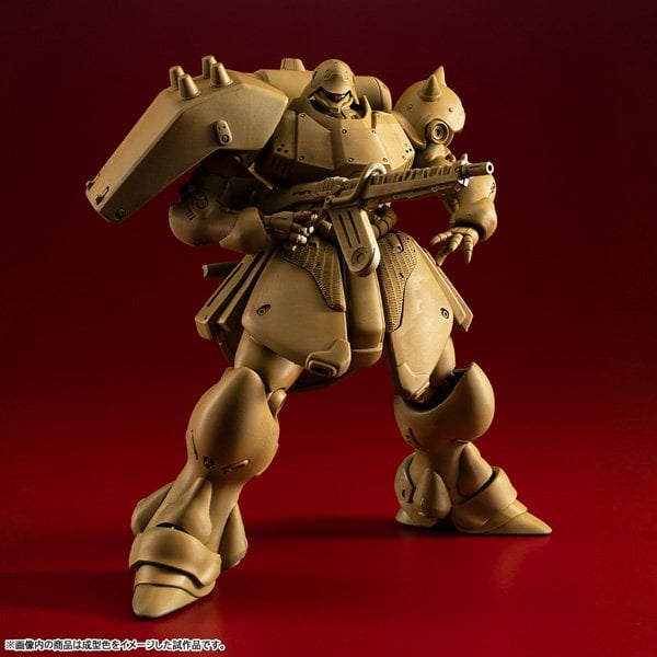 An unpainted, solid tan plastic injection build of the MegaHouse VAKIT Geara Doga Standard Type model kit to show the raw pieces out of the box.