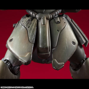 Macro close-up view highlighting the detailed texturing and weathered paint application on the front waist and skirt armor of the Geara Doga model kit.