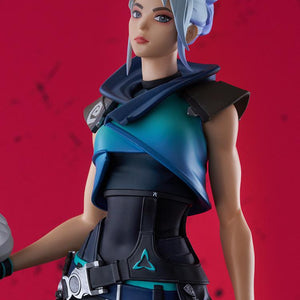 Detailed portrait close-up of Jett face sculpt and blue gradient top against a red background