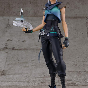 Full body front view of Valorant Jett Pop Up Parade SP figure standing on clear base against concrete wall backdrop