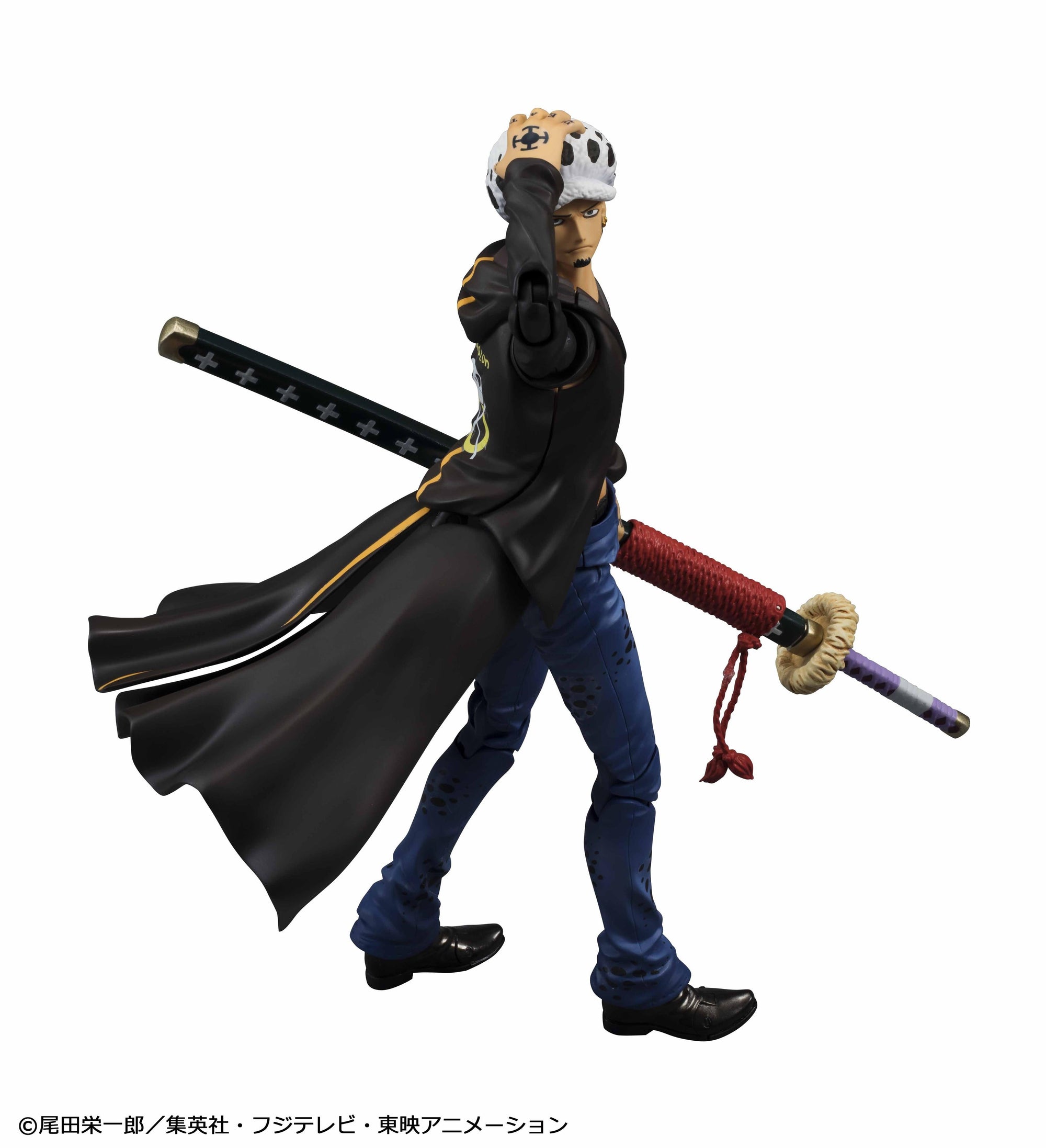 Side profile view of Trafalgar Law Variable Action Heroes figure adjusting his spotted hat with long black coat and sheathed sword.