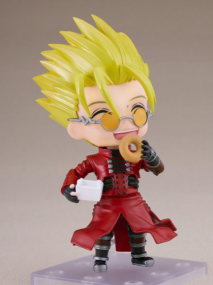 Trigun Vash the Stampede Nendoroid happily eating a donut while holding a takeout box with a joyful smiling face plate.