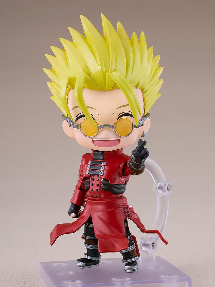 Vash the Stampede Nendoroid figure smiling happily while flashing the signature Love and Peace hand gesture.