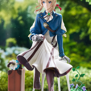 Front view diorama shot of Taito's Violet Evergarden figure set against a soft blurred green garden backdrop