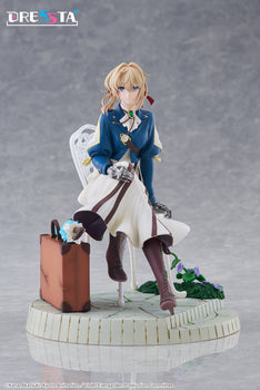 Full front view of Taito Violet Evergarden DRESSTA figure sitting on a white chair next to a suitcase on a stone base