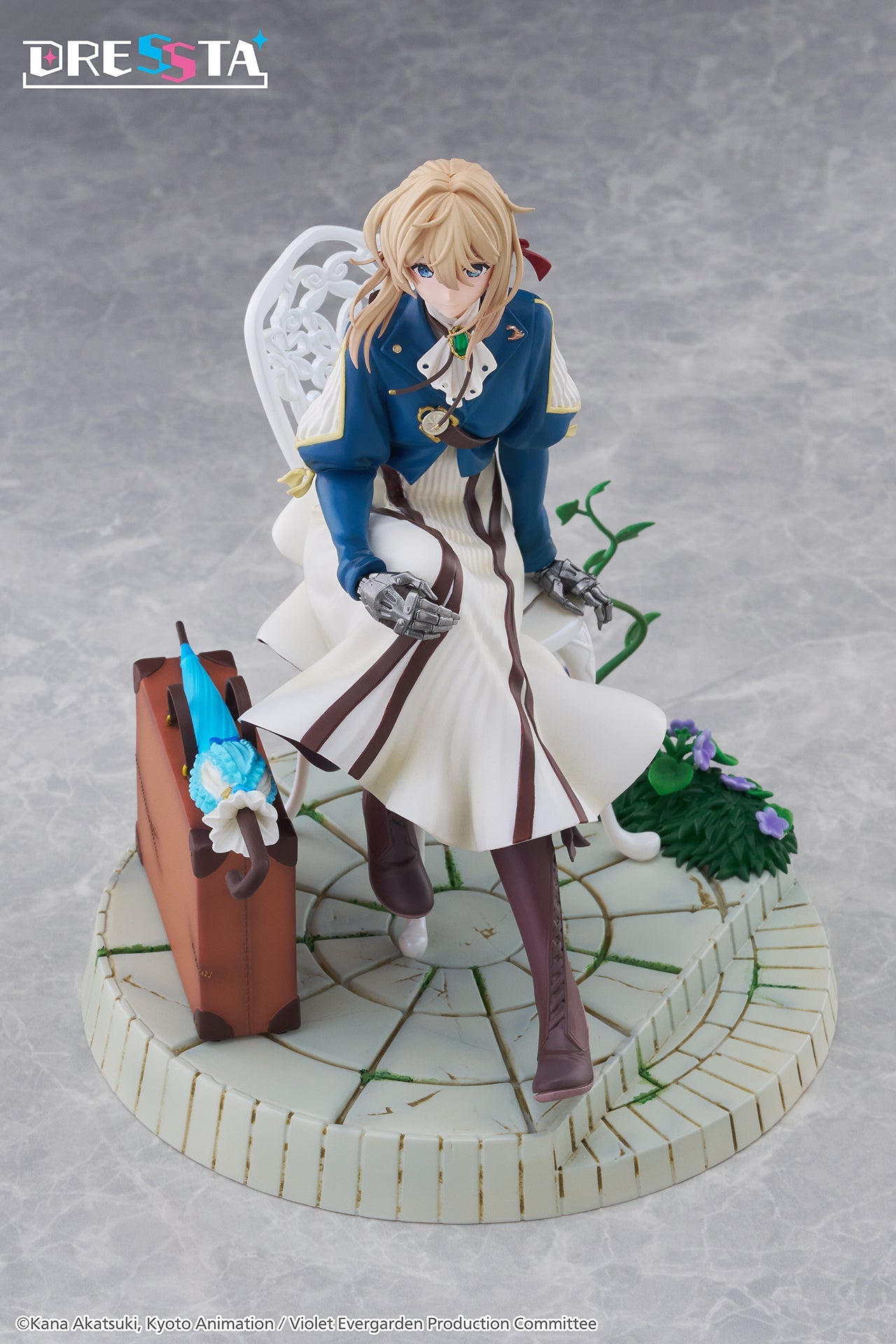 High-angle studio shot of the Violet Evergarden DRESSTA figure highlighting the layered dress and cobblestone base