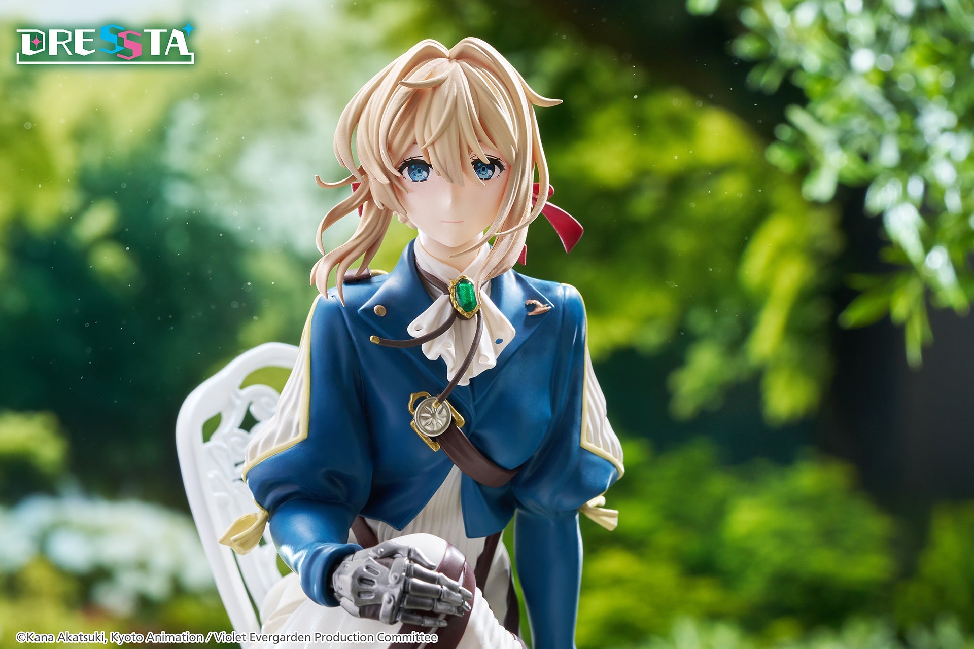 Tight portrait close-up shot of Violet Evergarden displaying her blue eyes, blonde hair, and emerald brooch in natural lighting