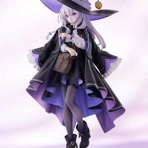 Three-quarter angle full-body shot of the Elaina scale figure showing outfit layers and brown satchel.