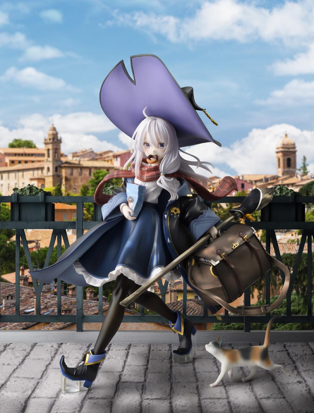 Promotional diorama image of the Elaina DX Version 1/7 scale figure composited against a scenic European hillside town background under a blue sky.