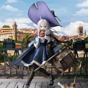 Promotional diorama image of the Elaina DX Version 1/7 scale figure composited against a scenic European hillside town background under a blue sky.