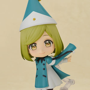 Dynamic action pose of the Coco chibi figure tilted sideways on her articulated display arm, recreating a magical flying movement with her teal cape flowing out.