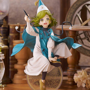 Full-body scenic showcase of the Coco figure displayed on a wooden desk within a vintage magic atelier diorama containing an astrolabe and antique books.