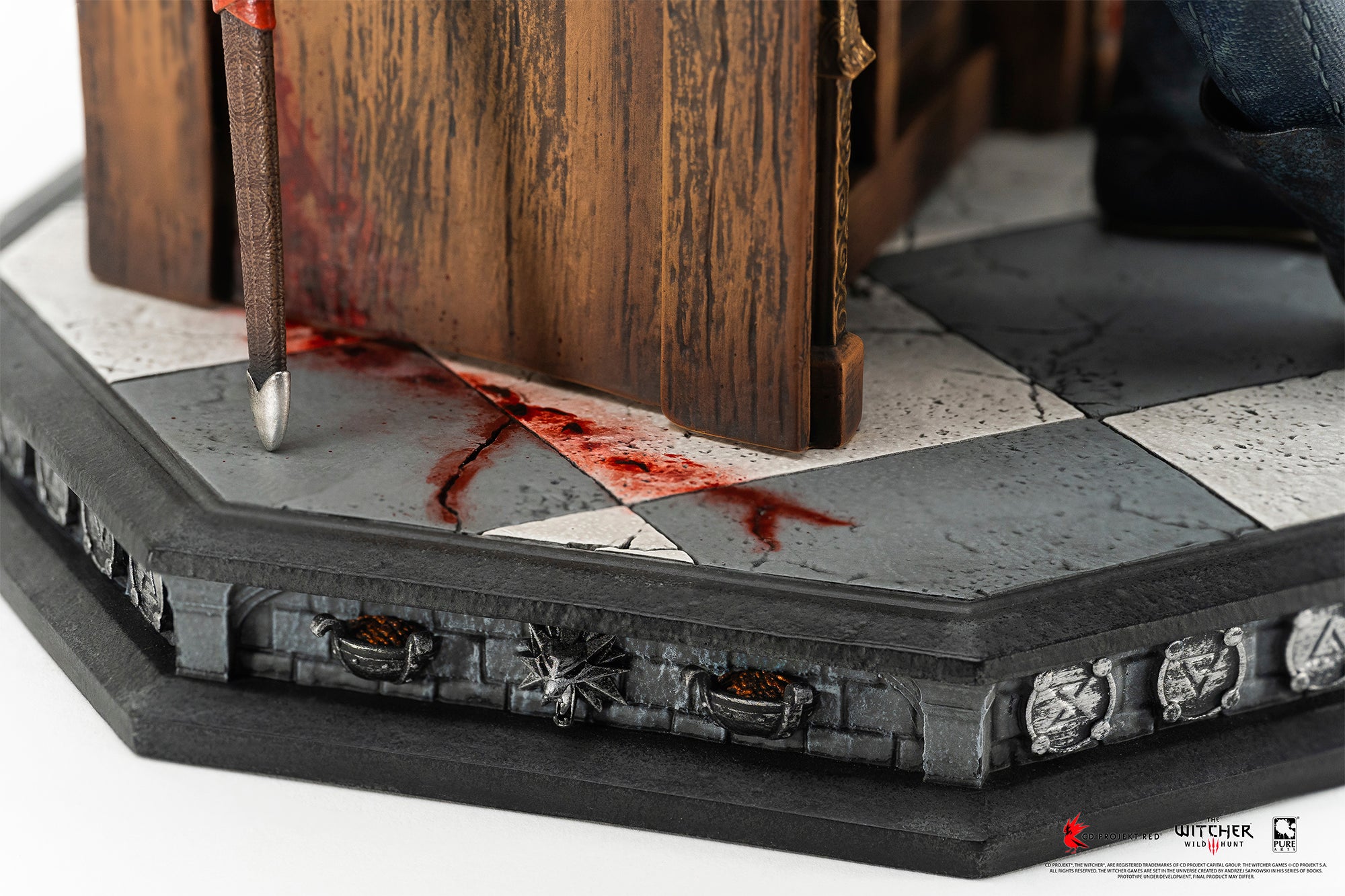 Detail view of the tiled stone pedestal base featuring blood pooling around the throne legs and carved Witcher signs along the rim.