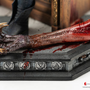 Close-up of the severed arm of High Vampire Dettlaff lying on the stone tiled base etched with Witcher sign symbols.