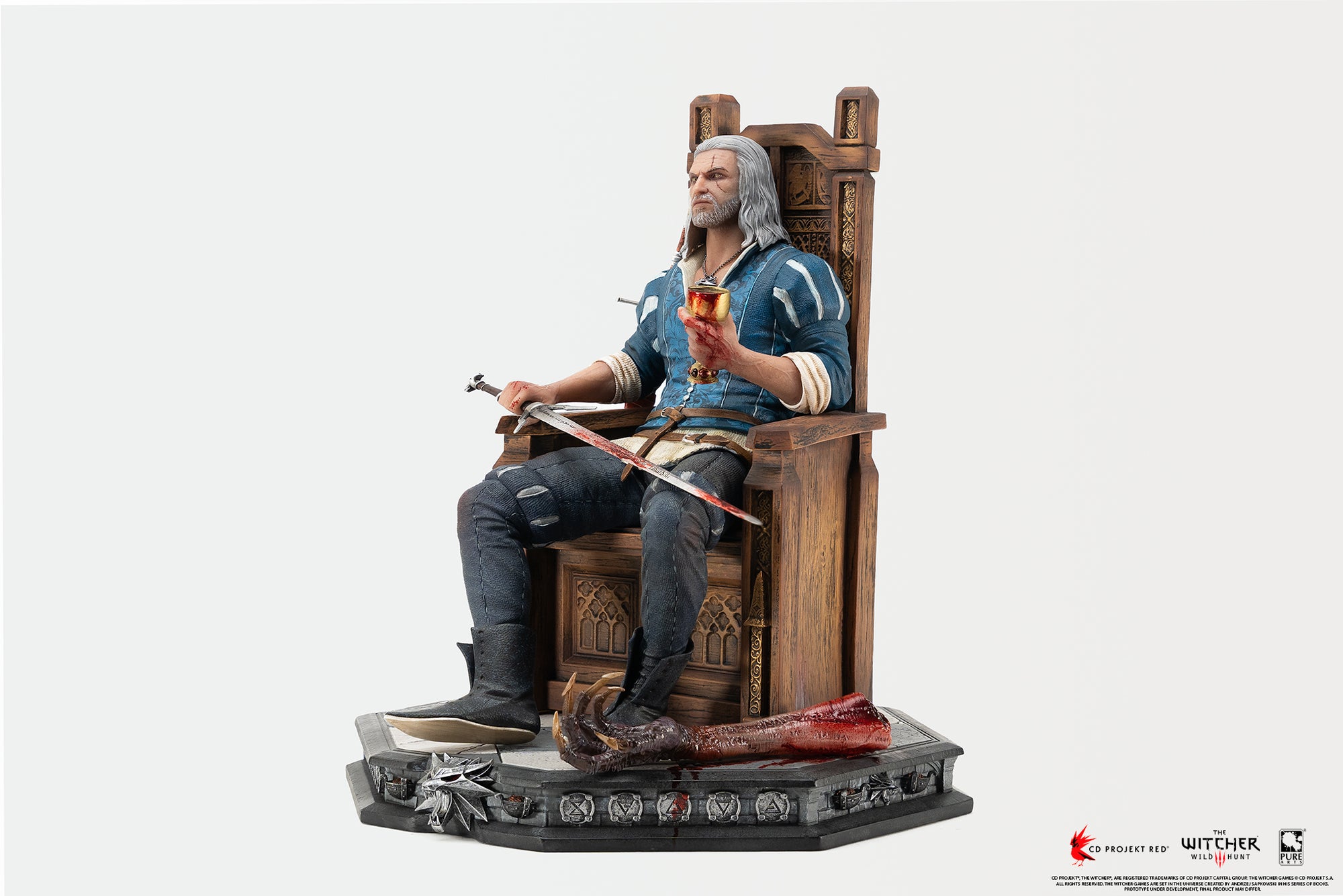 Three-quarter left view of Geralt of Rivia seated on his throne, holding a bloodied golden chalice in one hand and resting his silver sword across his lap.
