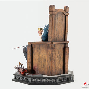 Left side profile view of the Geralt 1/6 scale statue detailing the throne construction and severed vampire arm on the base.