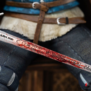 Close-up shot of the blood-stained silver blade detailing carved Witcher runes on Geralt's sword.