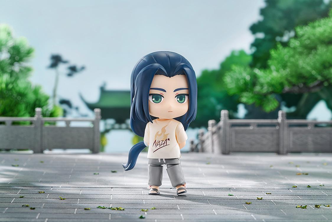 Outdoor diorama photo of the Wuxian NAZA T-Shirt Ver. Nendoroid figure standing on a stone courtyard path.