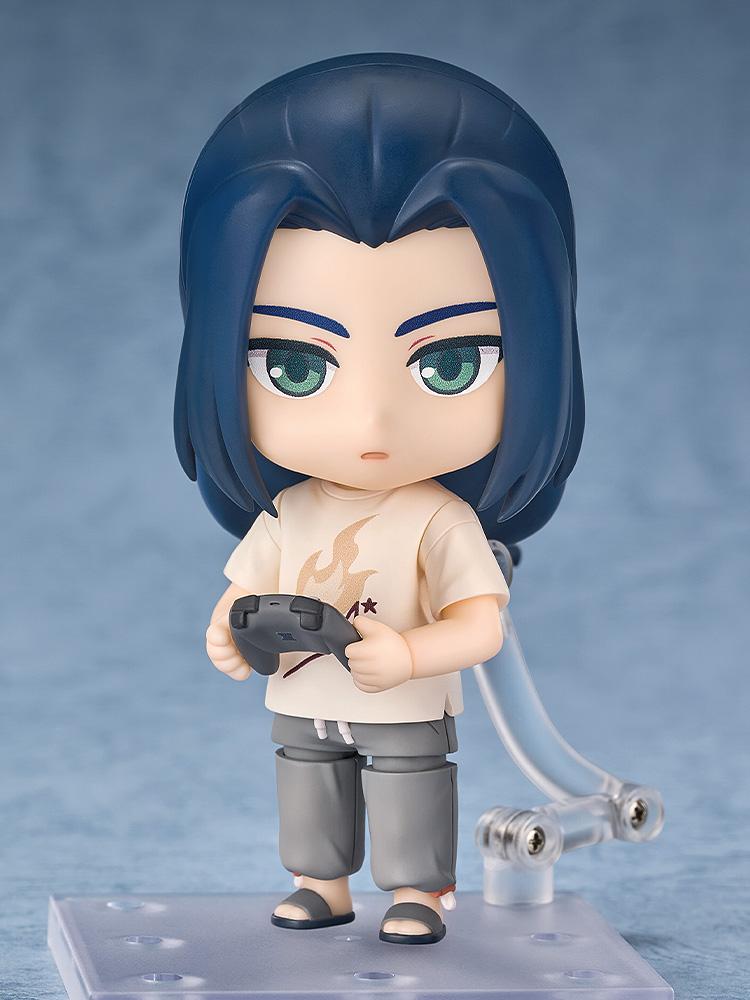 Front view of the Wuxian Nendoroid figure holding a grey video game controller accessory with both hands.