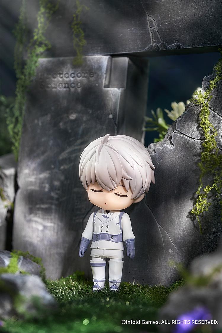 Close-up of Xavier Nendoroid with the sleeping face plate standing against a stone wall.