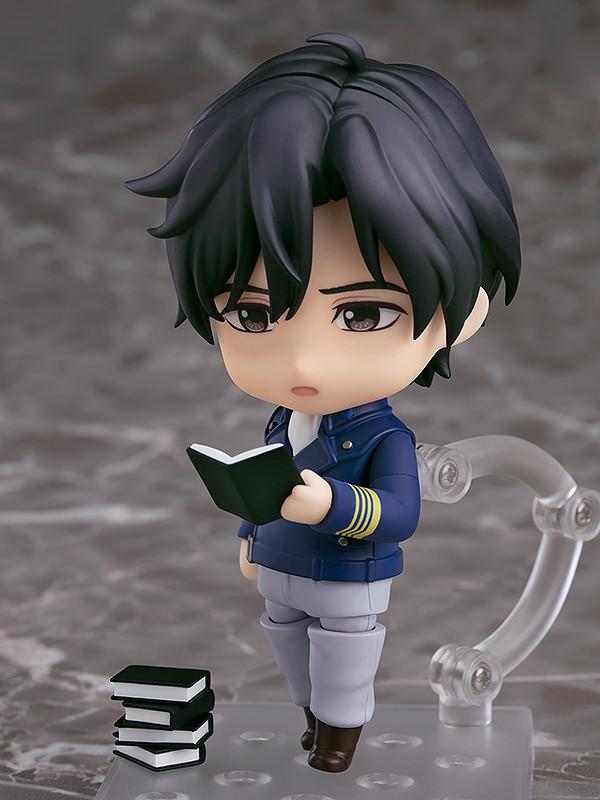 Yang Wen-li Nendoroid without his hat, holding an open book accessory to show his love for history.